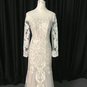 Sheer long sleeve lace wedding gown by Darius Cordell